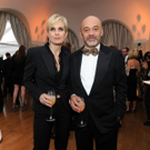 Schuhdesigner Christian Louboutin und Gast