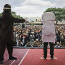 APTOPIX_Indonesia_Gay_Couple_Caned_61012.jpg
