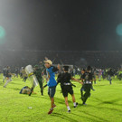 2022-10-02T072657Z_1524197421_RC2VSW9DMJAI_RTRMADP_3_SOCCER-INDONESIA-RIOT.JPG