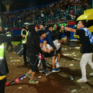 2022-10-02T072700Z_226566897_RC2VSW9DMT7M_RTRMADP_3_SOCCER-INDONESIA-RIOT.JPG