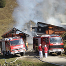 Almhütte in Flammen