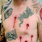 gunshot-bullet-holes-tattoo.jpg