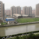 Hochhausrohbau in Schanghai umgekippt