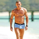 niel-craig-topless-bare-chest-tight-swim-trunks-bulge-package-walk-on-beach-sand-ocean-wrist-watch-muscles-ripped-body-physi.jpg