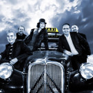 K1600_Herwig_Taxi Rohm_Wolken_Hintergrund_TAXI-SCHILD-m.JPG